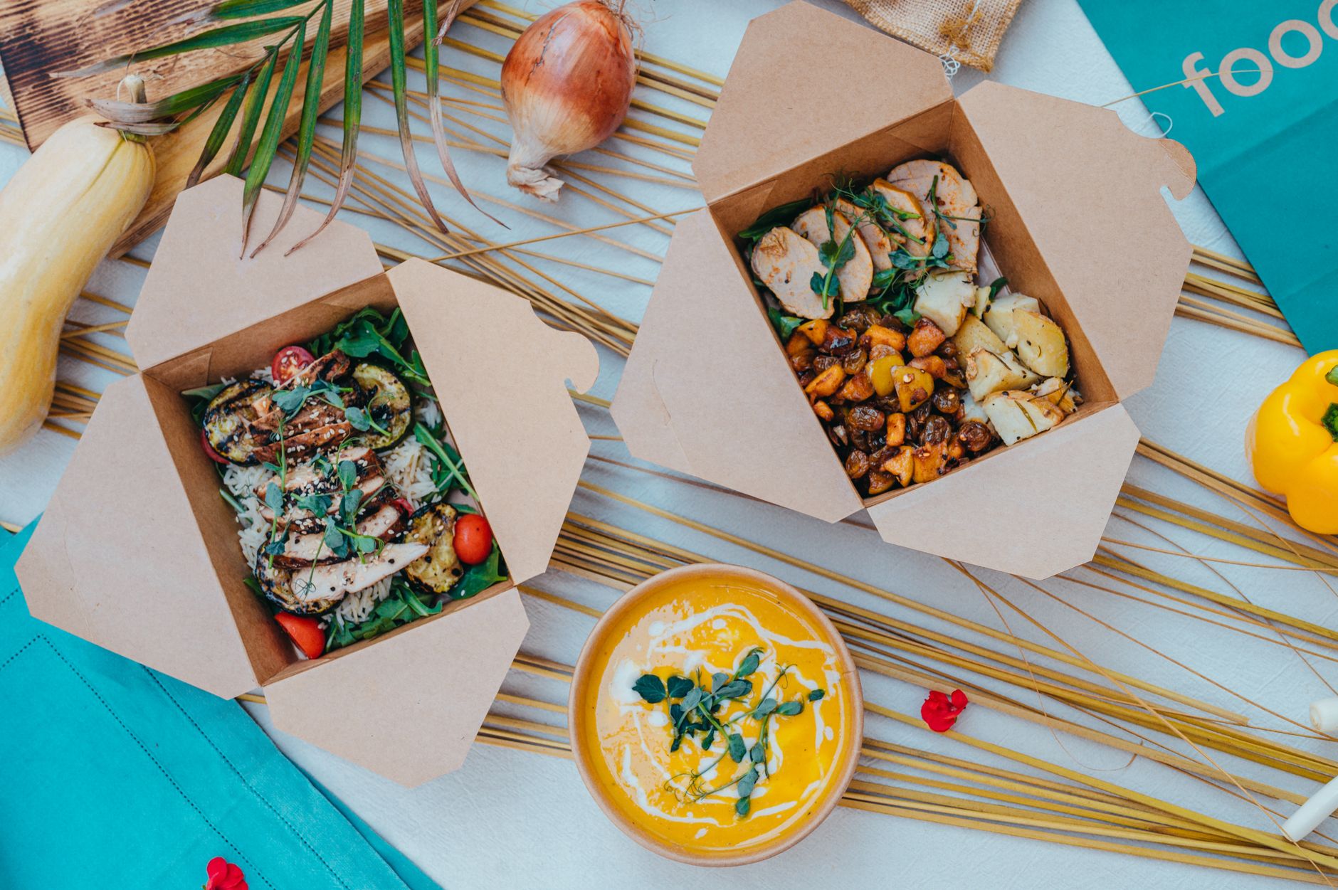 Packed lunch boxes with salads, vegetables and soup ready to take to work