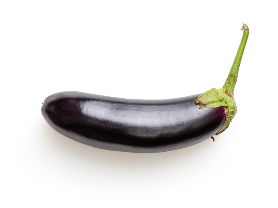 A whole purple eggplant with its green stem on a white background