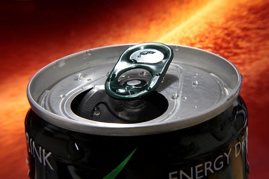 Open energy drink can covered in condensation