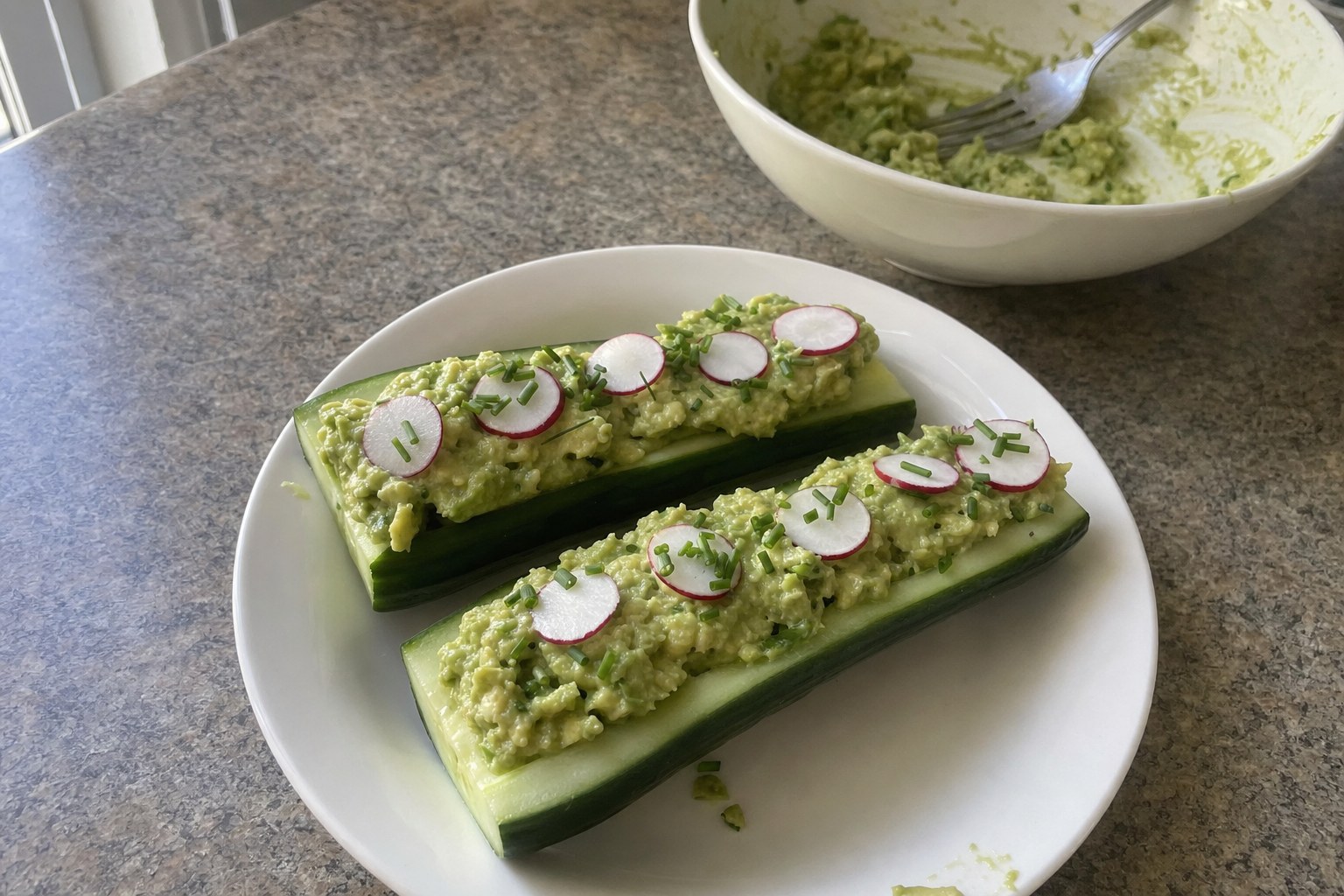 Homemade cucumber Boats with Avocado and Chives