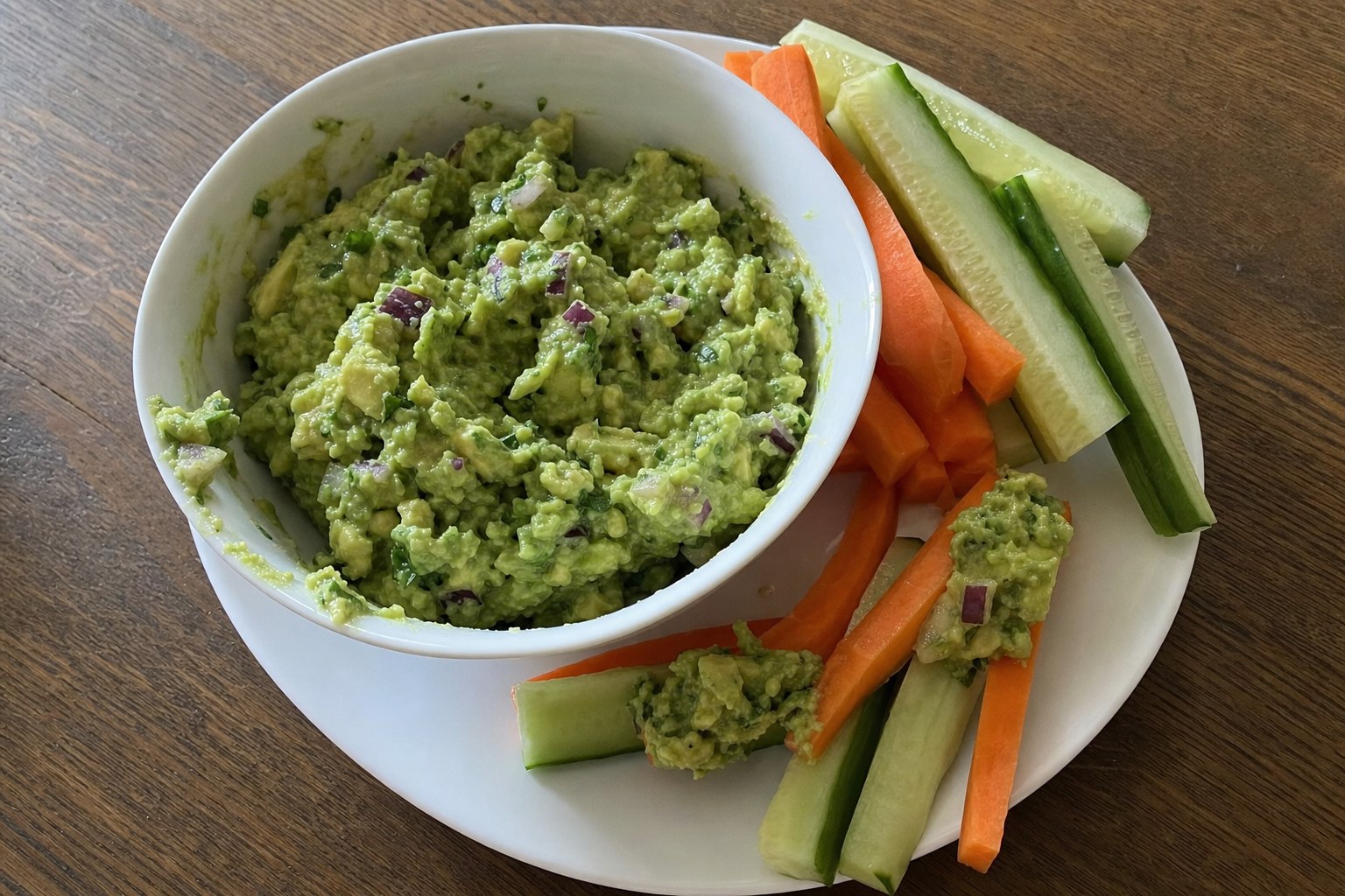 AIP guacamole with carrot and cucumber sticks